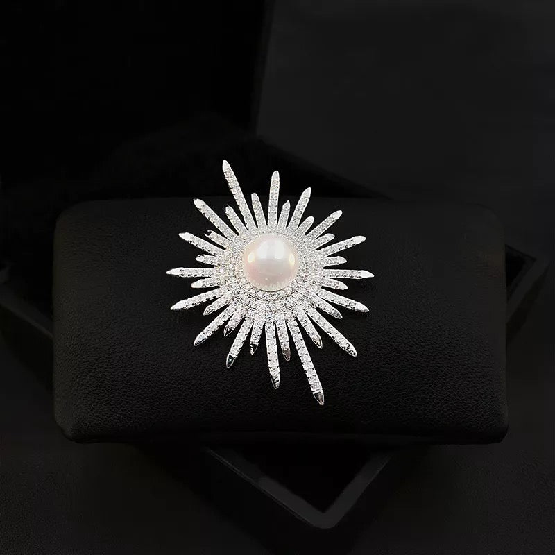 Crystal sun brooch