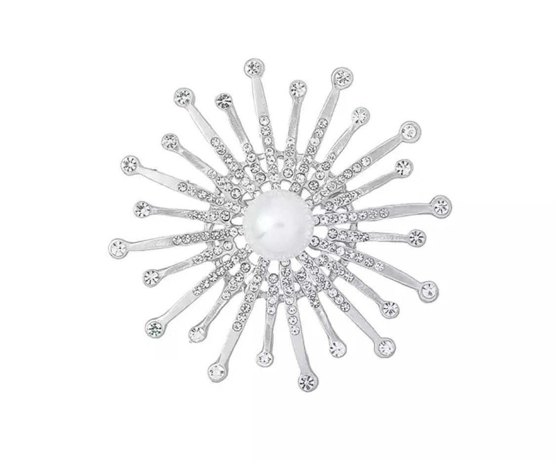 Silver sun brooch